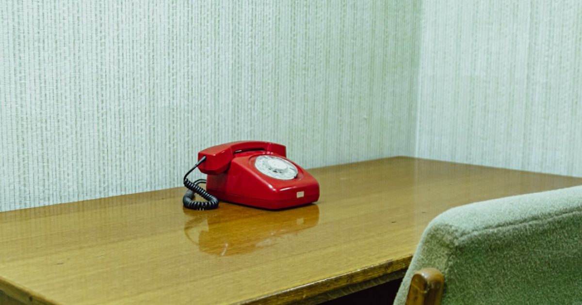 Hotel front desk with a calculator and invoice